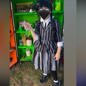 Wednesday Adams Costume with a wig and black tights size 6